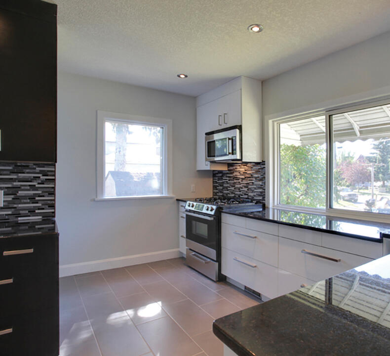 Total kitchen refresh including opening up the kitchen to the living space and adding an eating bar in the dining room.