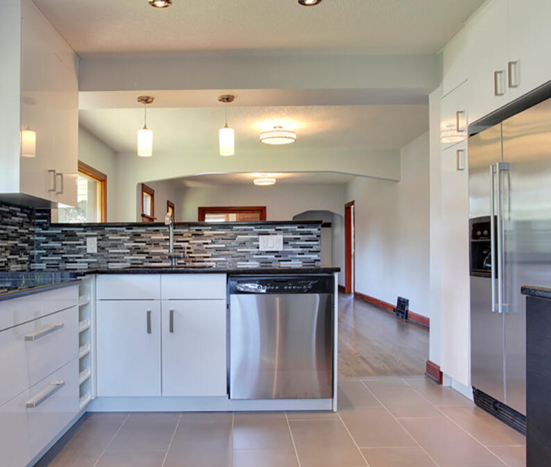 Total kitchen refresh, included opening up the kitchen to the living space and adding an eating bar in the dining room.